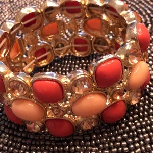 Coral colored stones on stretch bracelet